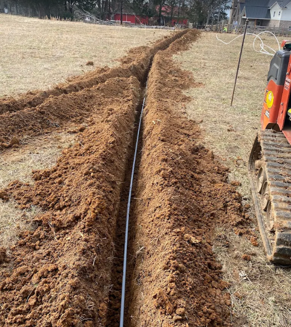 Trenching for a new irrigation main line