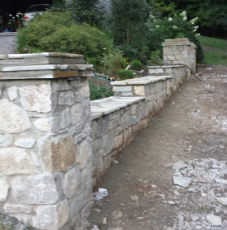 Natural stone retaining and seat wall